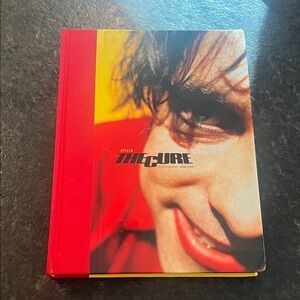 The Cure Photography Book with Red and Yellow Cover
